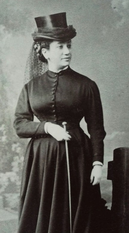 Public Domain — A riding habit and top hat, 1870s. La Païva galloped the park at Pontchartrain dressed as a man, scandalising the villages. Her yellow Donnersmarck diamond weighed 82.4 carats.
