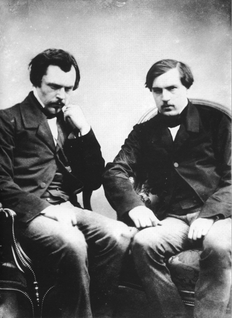 Public Domain — Edmond and Jules de Goncourt, diarists of Second Empire Paris. They described La Païva's powdered face as concealing another: the terrible face of a painted corpse.