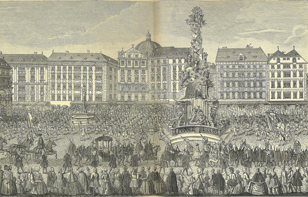 A baroque imperial procession, Europe, late 17th century. The towering column at its centre was not built for ceremony. It was built because a city had survived a plague that killed 75,000 of its people.
