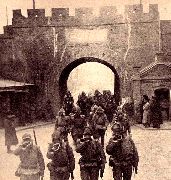 Japanese troops march into Qiqihar during the invasion of Manchuria in 1931, as Japan expanded its control over the region.