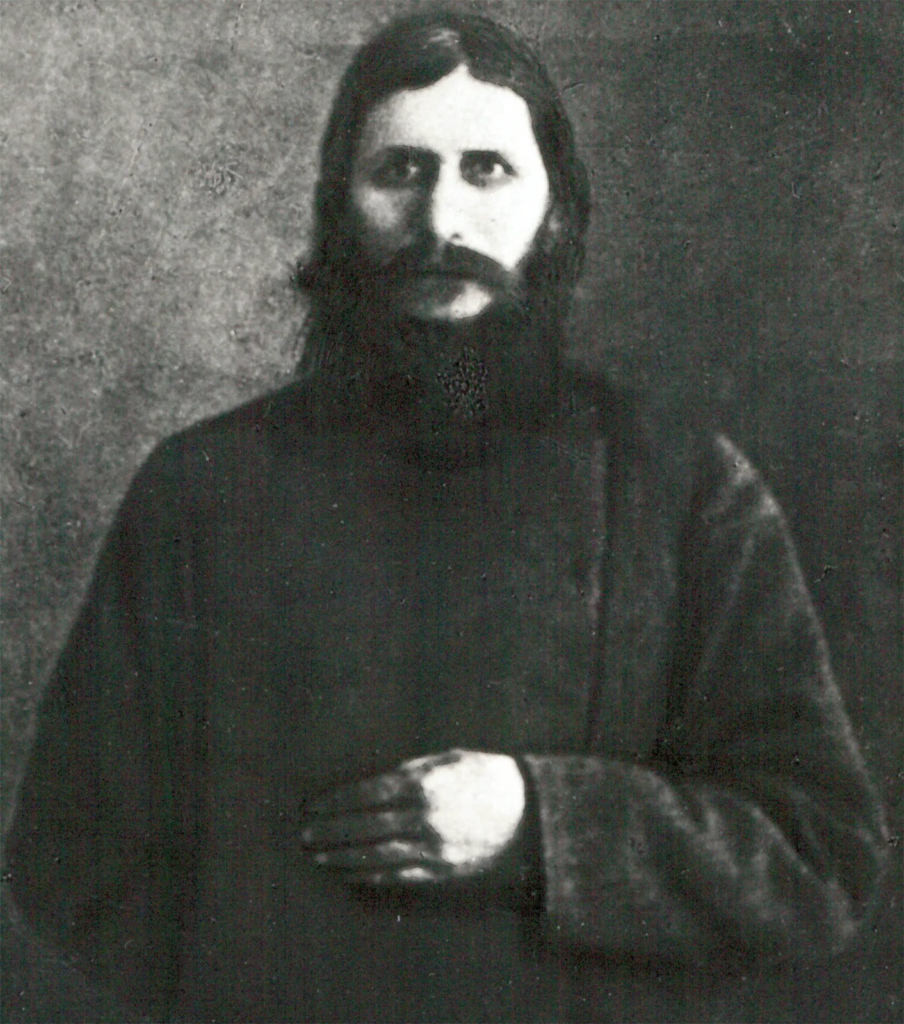 Grigori Rasputin in an early photograph, dressed as the wandering holy man whose reputation for healing would bring him to the attention of the Romanovs.