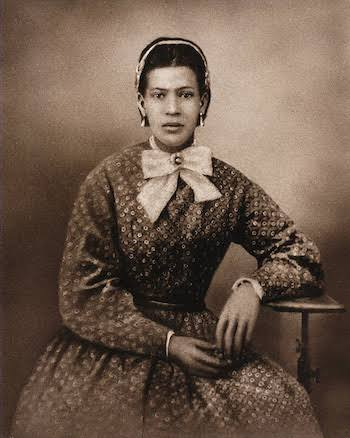 A studio portrait of an unidentified woman from New Orleans, circa 1860s to 1880s, the decades in which Marie-Philomène Glapion carried the Laveau name through a city that was already turning against the religion she practiced.