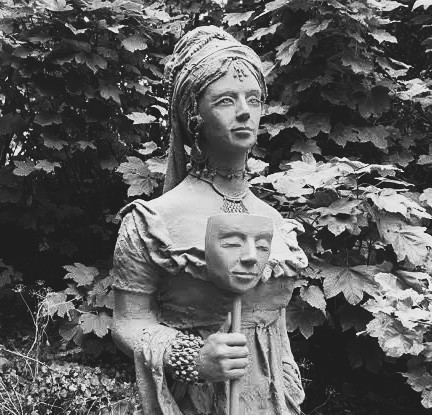 A statue of Princess Caraboo, holding a mask of her own face. In life, Mary Willcocks carried two identities for ten weeks and spent the next four decades trying to put one of them down. She died on Christmas Eve 1864 and was buried in an unmarked grave in Bristol. No stone was ever placed.
